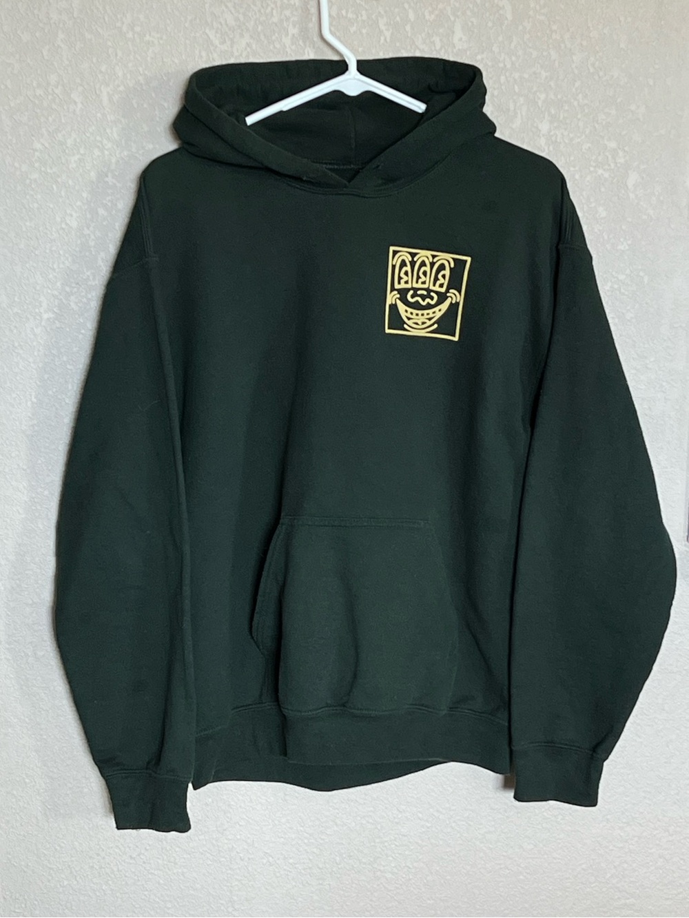 Keith Haring Men's Dark‎ Green Hoodie with Three Eyed Smiling Face Chest Graphic